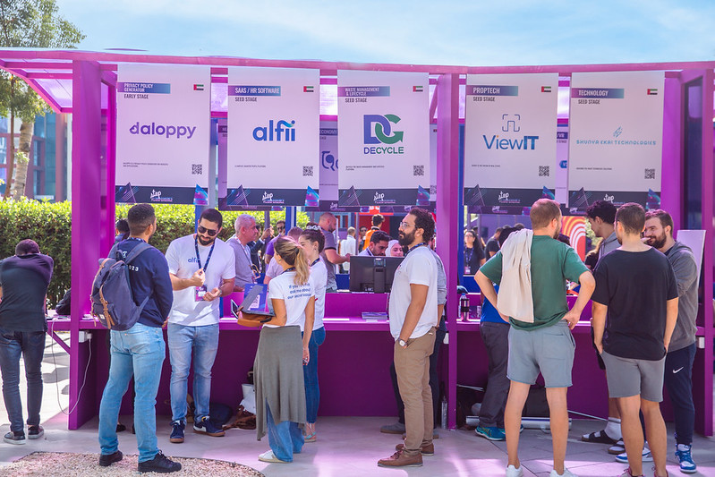 Startups at their booths on the floor at Step Dubai